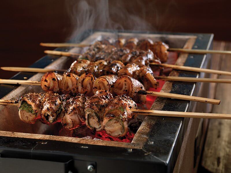 Pork kushiyaki over Japanese coals delivers the flavor of fire, along with complex, savory notes from togarashi and tare sauce (pork, sake, mirin, light soy sauce and black pepper).