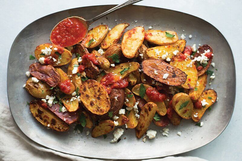 Fingerling potatoes roasted with cumin and boosted with harissa and feta demonstrate the flavor-forward side of this trend.