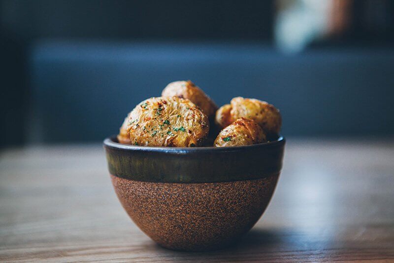 At Otium in Los Angeles, Crispy Potatoes make for easy eating with a seasoning of lemon salt, Aleppo pepper and crème fraîche.