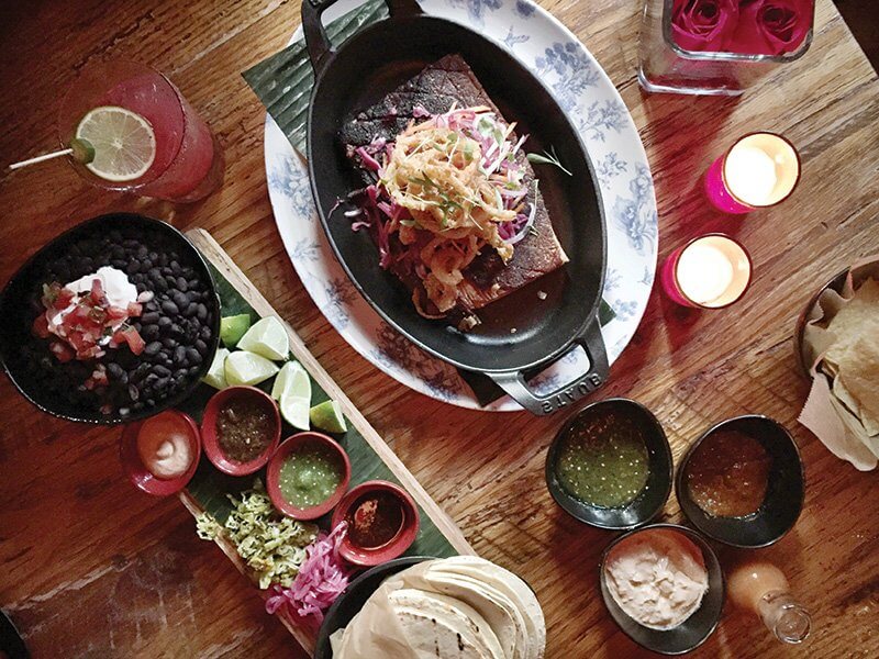 With versatility in size options, skillet preparations showcase on-trend shareability. This Pork Belly Carnitas Feast is one of the new shareable platters at Lolita Cocina in Boston, topped with escabeche salad and onion strings, served with tortillas, black beans and salsas.
