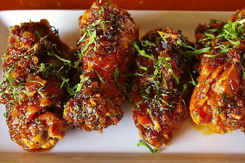 Mopho’s wings offer an intriguing combination of nuoc mam caramel, lemongrass, ginger and Thai chile.