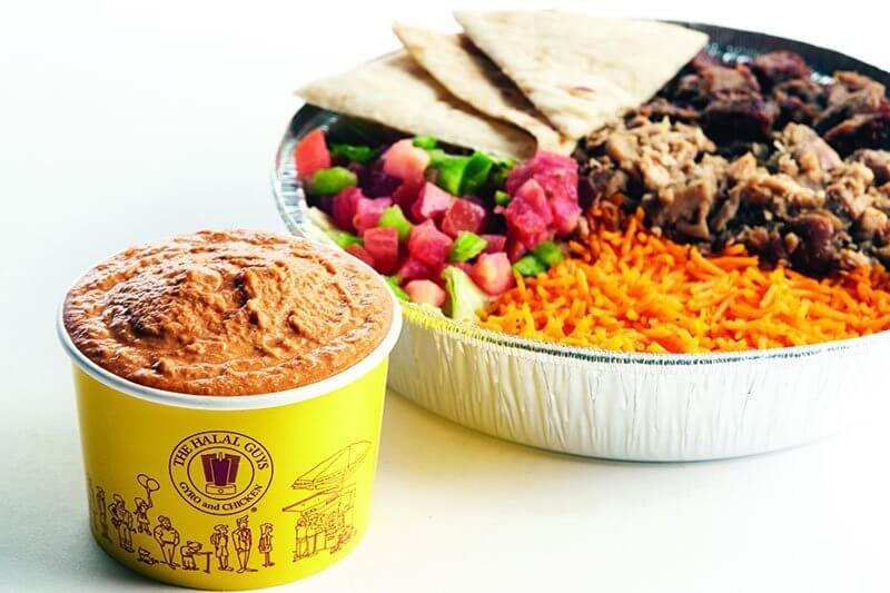 The Halal Guys earn street cred with authentic Middle Eastern fare. Strategic menu additions include new sides like Spicy Hummus.