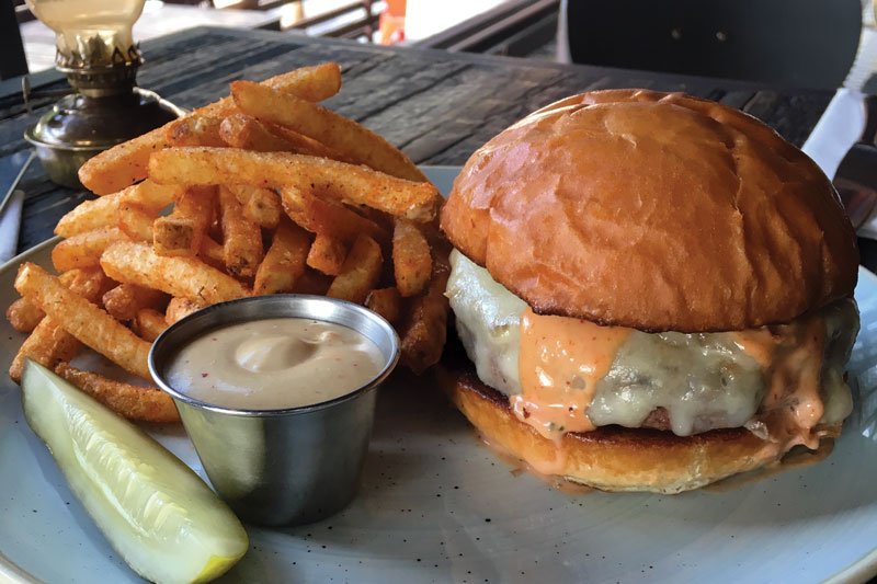 Grass-fed beef signifies the premium quality of the C&C Burger at Craft & Commerce in San Diego.