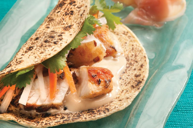 At Chicago’s Kendall College, Christopher Koetke demonstrates how fish tacos can tap into global flavors with these barramundi tacos topped with pickled daikon radish, carrot and sesame-soy yogurt sauce