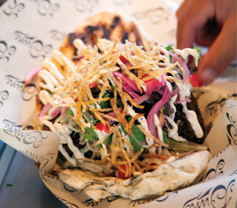 Both traditional and creative, the falafel at Dune in Los Angeles comes in a puffy housemade flatbread and is crowned with shoestring potatoes dusted in sumac and salt.
