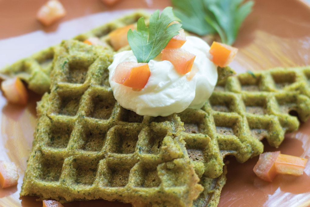 Showcasing the adaptability of falafel, this Chickpea Falafel Waffle, or “fawaffle,” sees a filling of chickpeas, cumin, coriander and fresh parsley transformed into a brunch item.