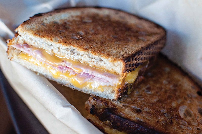 Rosemary butter makes a fragrant addition to the Piglet sandwich, with cheddar, Duroc ham and apple mustard at The American Grilled Cheese Kitchen in San Francisco.