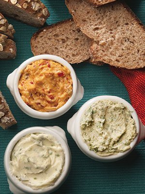 Sublime butter variations created by Kendall College’s Christopher Koetke (clockwise from top): avocado, lime and cilantro butter; classic maître d’hôtel butter with parsley; chipotle-adobo sauce butter.