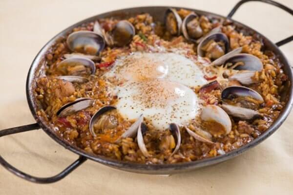 paella-with-chicken-chorizo-clams-and-shirred-eggs Paella With Chicken, Chorizo, Clams And Shirred Eggs