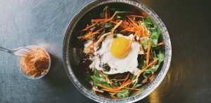 Chicago’s Seoul Taco serves up Korean-Mexican fusion like this Gogi Bowl with rice, fried egg, carrots and spicy gochujang.