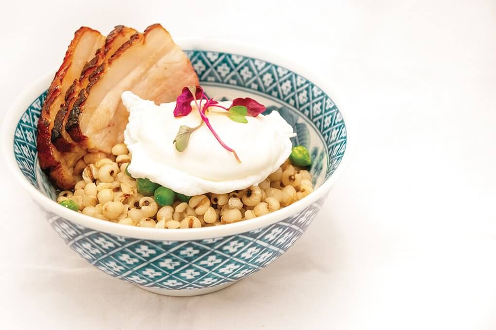 At Oregon State University, Job’s tears, also known as Chinese pearl barley, are cooked in dashi broth with shoyu pork, pickled mushroom, green chickpeas and poached egg.