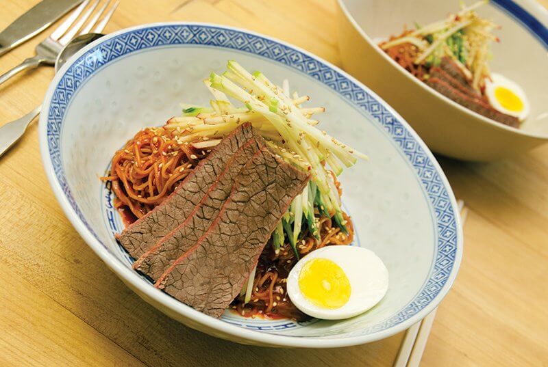 This dish of Cold Korean Spicy Noodles with beef, served at the University of Massachusetts, showcases the global flavor trend and bowl trend beautifully.
