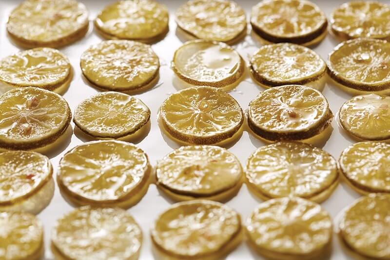 Both beautiful and versatile, candied citrus—like these Key lime slices—offers plentiful opportunities for garnishes and accents across the menu.