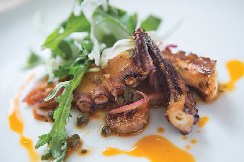 At Harvest in Edwards, Colo., grilled octopus gets considerable zing from a citrus and paprika oil, along with capers, fresh fennel, arugula and fingerling potatoes.