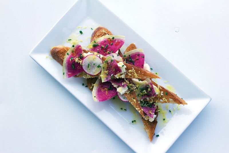 Zesty is the word for this watermelon-radish toast offered at Salt & Vine in Nashville, where confetti-like lemon zest adds to the brightness of the dish.