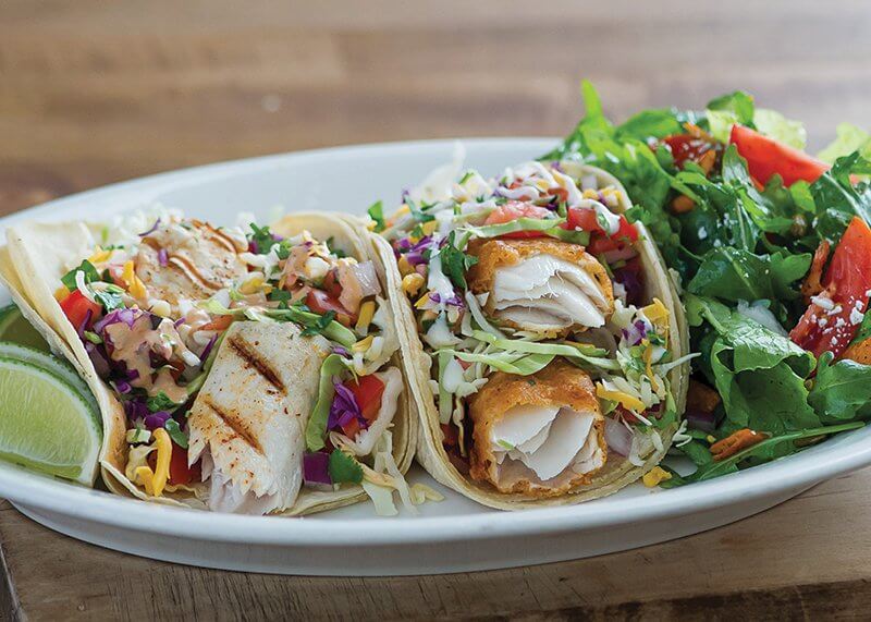 Customizable seafood favorites, like this fish taco plate, are offered at Sharky’s Woodfired Mexican Grill throughout the year. “We want to create a habit that lasts all year long,” says Sharky’s David Goldstein.