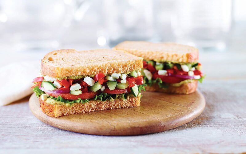 Panera replaces mayonnaise with a cilantro-jalapeño hummus in its Mediterranean Veggie Sandwich, which also stars Peppadew peppers, tomato and feta cheese.