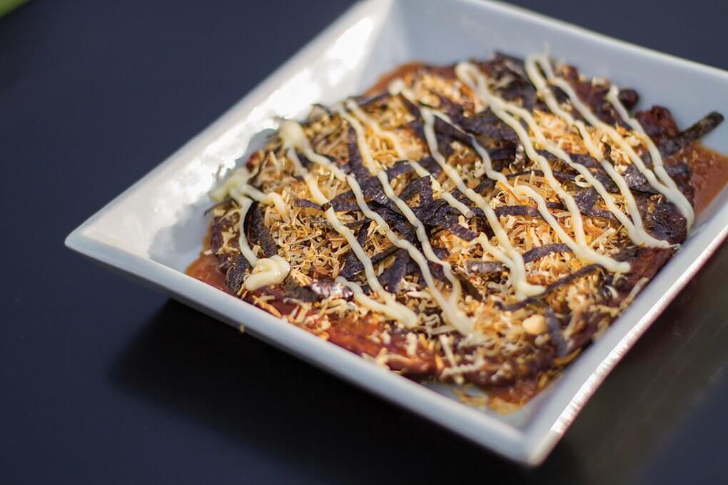 Craveable and umami-rich, okonomiyaki is primed for menu adoption here. Perfect as a shareable, this savory cabbage pancake often boasts inclusions like spring onion and bacon, and then is topped with an addictive combination of sweet soy glaze and Kewpie mayo.