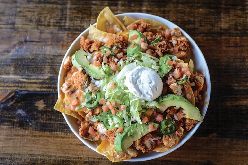 Nachos are an ideal platform for introducing new flavor systems. In Nashville, Tenn., they serve as a base for Party Fowl’s signature Hot Chicken, with a topping of white beans, cheese, avocado, jalapeños, green onion, lettuce, pico de gallo and sour cream.