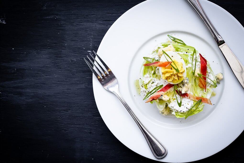 A renewed appreciation for crisp lettuce is driving innovation in salads. Midtown Grille in Raleigh, N.C., offers a modern take on a craveable classic in its Iceberg Salad with applewood bacon, deviled egg, blue cheese and buttermilk.