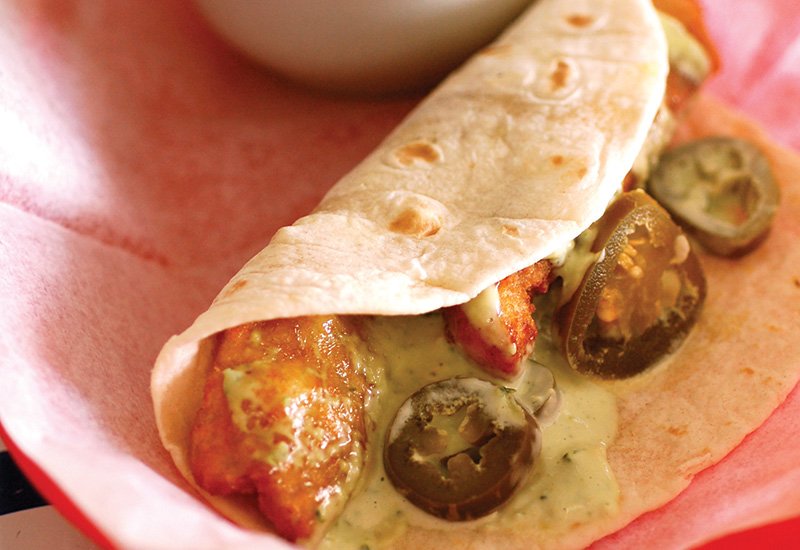 poblano tartar sauce and pickled Jalapeños add zing to taqueria del sol’s fish taco.