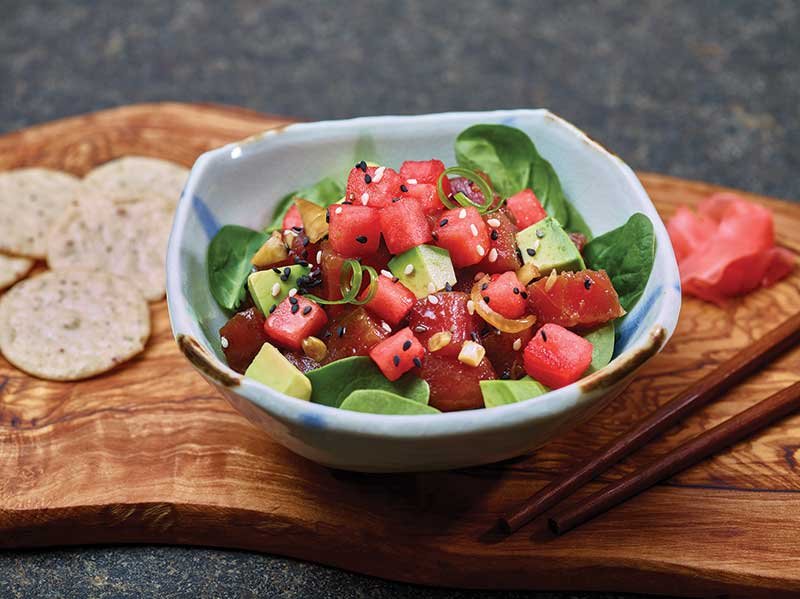 Watermelon juice adds sweet freshness to a dressing of soy, garlic, ginger, onion and sriracha. 