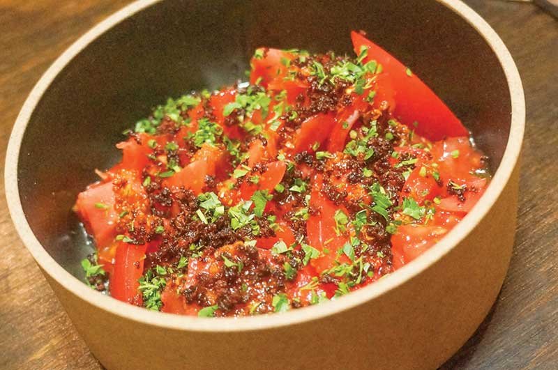 Veg-centric benefits from a boost of protein like in this tomato dish with bagna cauda at Here’s Looking at You in Los Angeles.