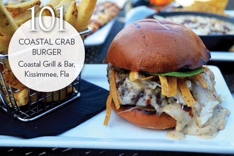 Coastal Crab Burger topped with spinach salad, crab dip, tortilla strips