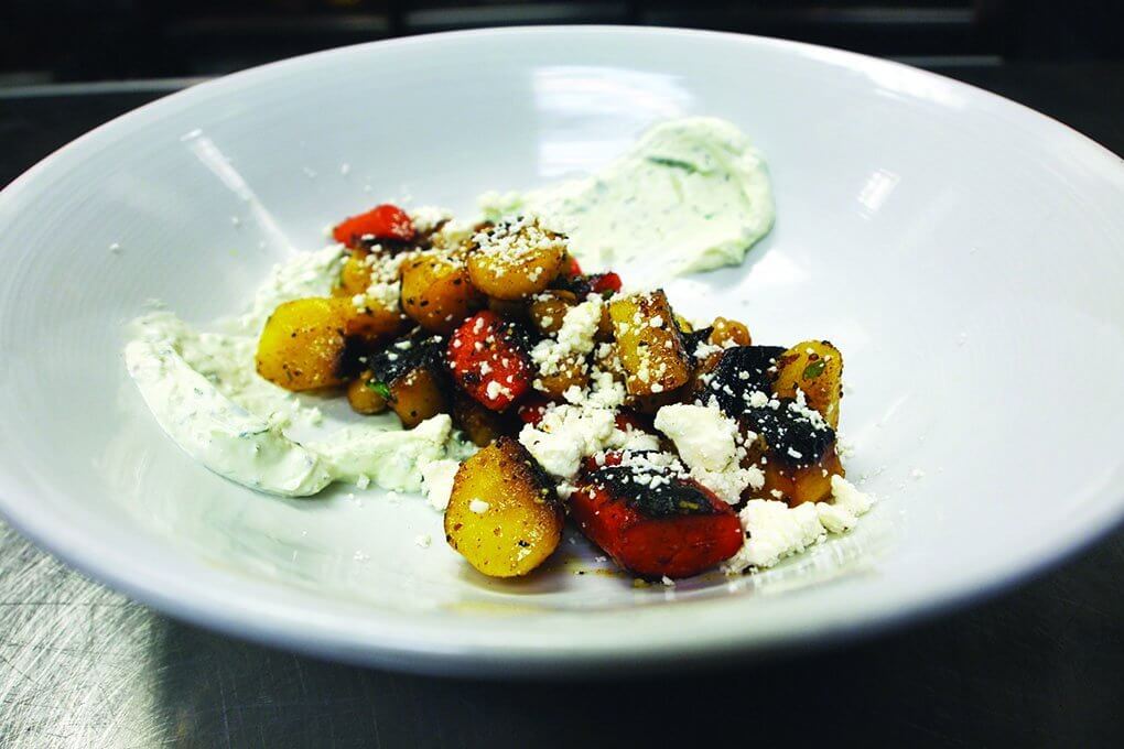 Charred Heirloom Carrots combine with tzatziki, spiced chickpeas and feta for a modern interpretation at American Harvest Eatery in Springfield, Ill.