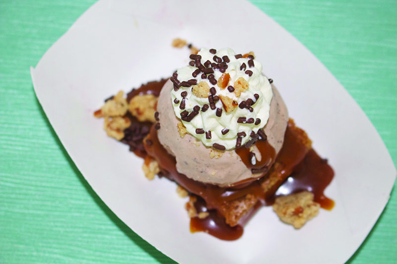 Salt & Straw’s Brown Butter Blondie Sundae features premium chocolate and coffee ice creams, warm caramel sauce, whipped cream and crushed pretzel streusel.