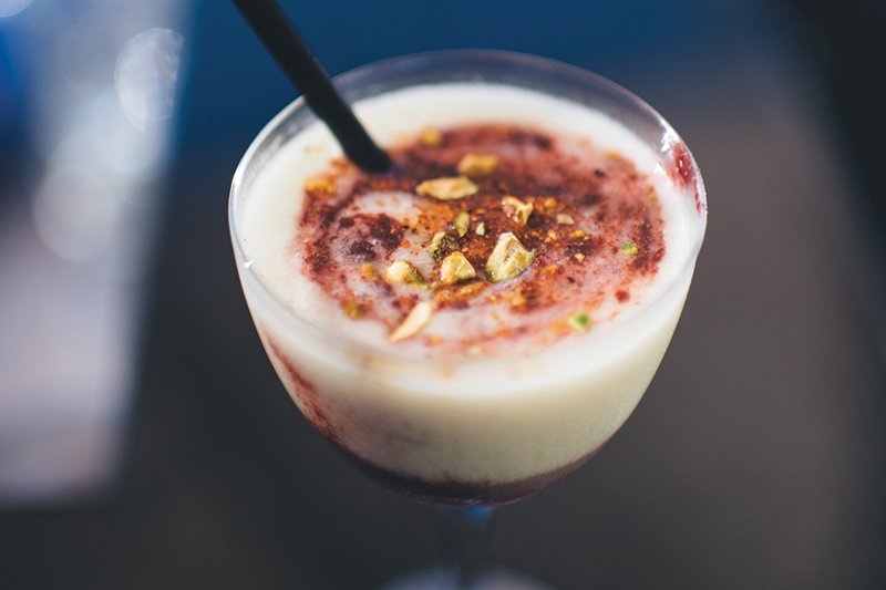 Created by Commer Beverage, this Blackberry Avo’Rita has a creamy avocado base and is topped with crushed Sriracha almonds.