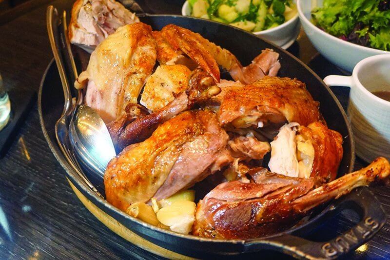 Le Coq Rico in New York serves simple yet intensely flavorful whole chicken. The Catskill Guinea Fowl is allowed to develop slowly, for 130 days.