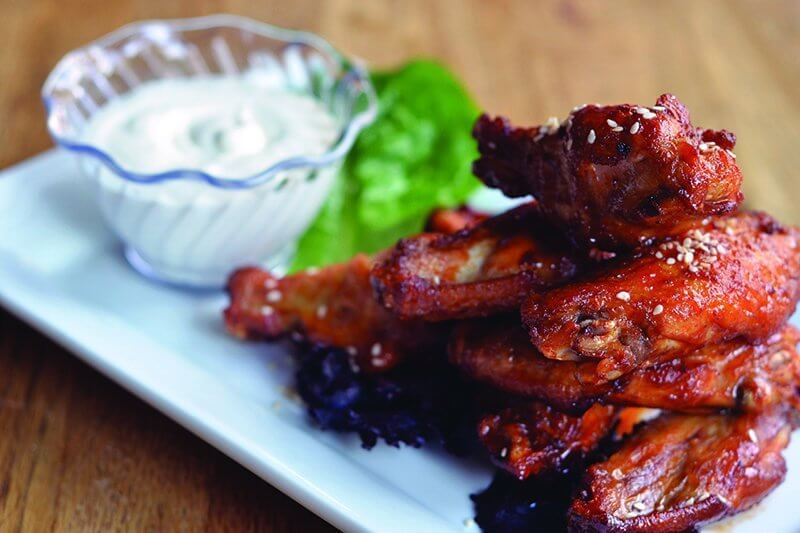Gochujang is the key ingredient in making these Kimchi Marinated Chicken Wings so craveable at Publik Draft House.