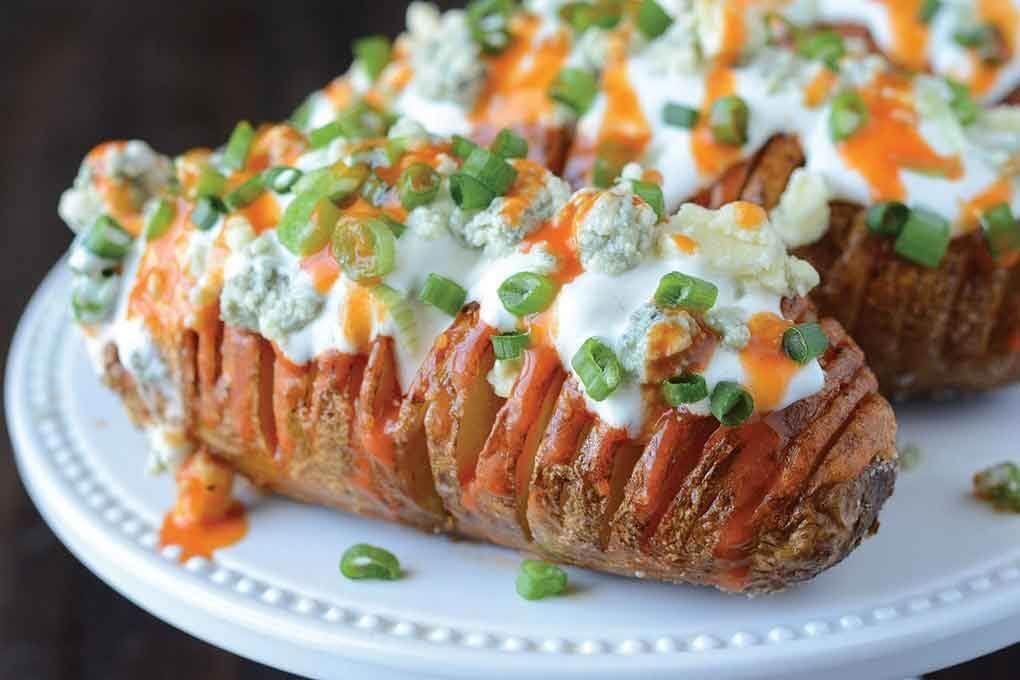 Hasselbacks invite exploration of winning flavor systems, like Buffalo. This Hasselback Russet Potato brings Buffalo sauce, blue cheese and green onion into a new format