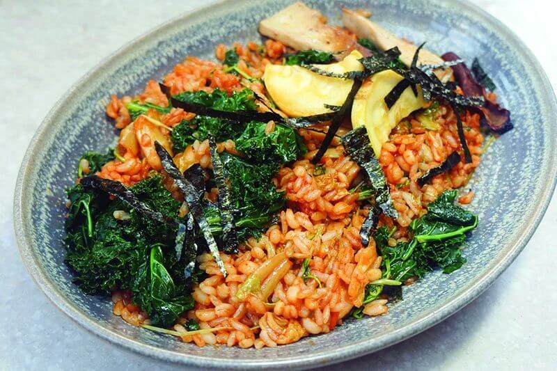 Global ingredients intersect in this Kimchi Barley and Fried Rice at M Café in Los Angeles, adding complexity to an otherwise simple dish.