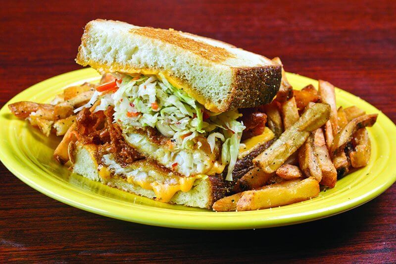 Diving into seafood, Melt Bar and Grilled includes battered pollock in its Lake Erie Monster, along with sweet slaw, American cheese and jalapeño tartar sauce.