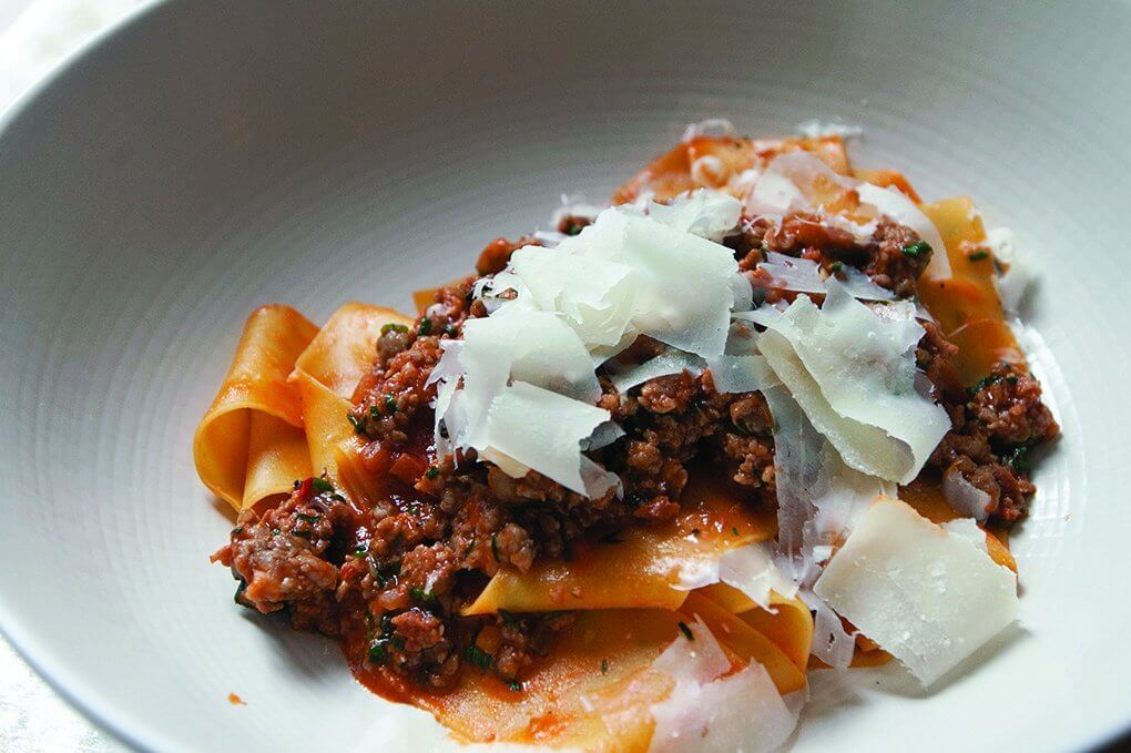 Upland Miami offers a range of comfort pasta dishes including a housemade pappardelle ragù with spicy sausage and Parmesan.