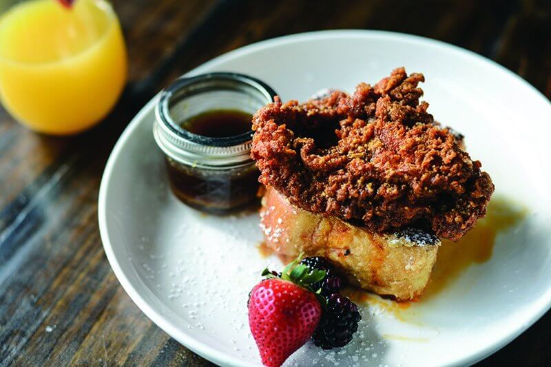 Party Fowl serves a Hot Chicken & Stuffed French Toast on its brunch menu, cleverly tying Nashville hot chicken to breakfast fare.