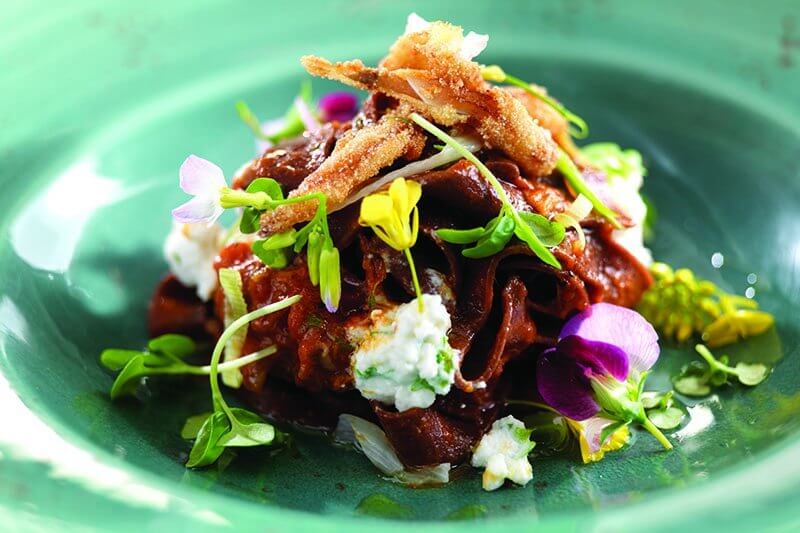 Old-country techniques bring instant credibility. This Pasta al Sangue Tagliatelle incorporates pig’s blood in the pasta, braised meat from a pig’s head, and crispy pig’s ears as garnish.