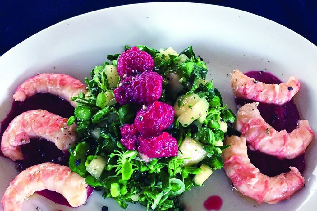 Pickled raspberries offer a surprising pop of flavor to this prawn and broccolini dish, served at StrEAT Food Trailer in Bellingham, Wash.