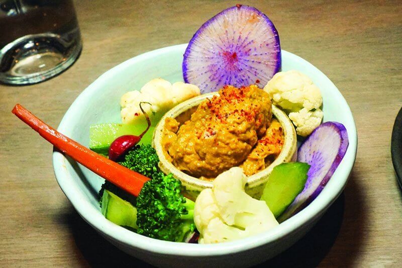 Pumpkin Hummus with raw, cooked and pickled crudité at Rouge Tomate in New York