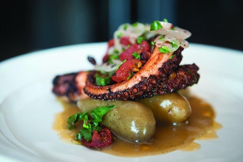 Michael Pirolo serves this starter of Smoked Potatoes with Octopus at Macchialina in Miami Beach, Fla.