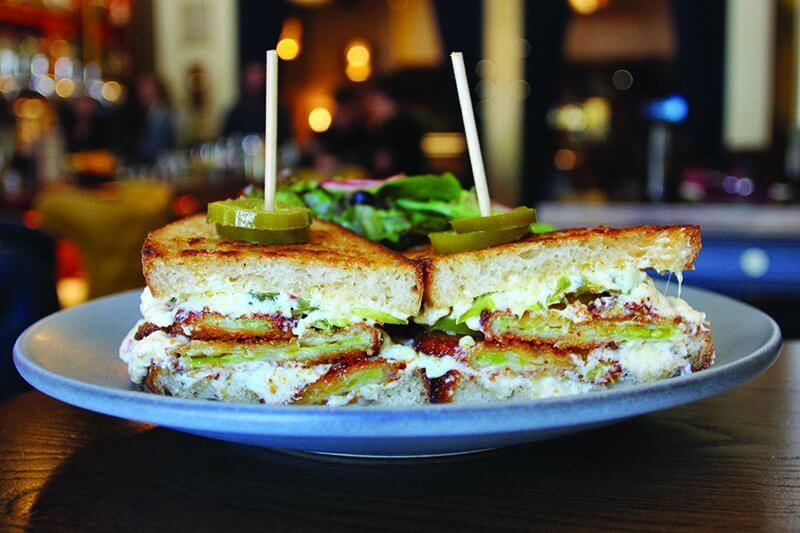 In a nod to both heritage and modern trends, the Southern Grilled Cheese at Finn Town includes fried green tomatoes, pickled jalapeño and housemade pimento cheese.