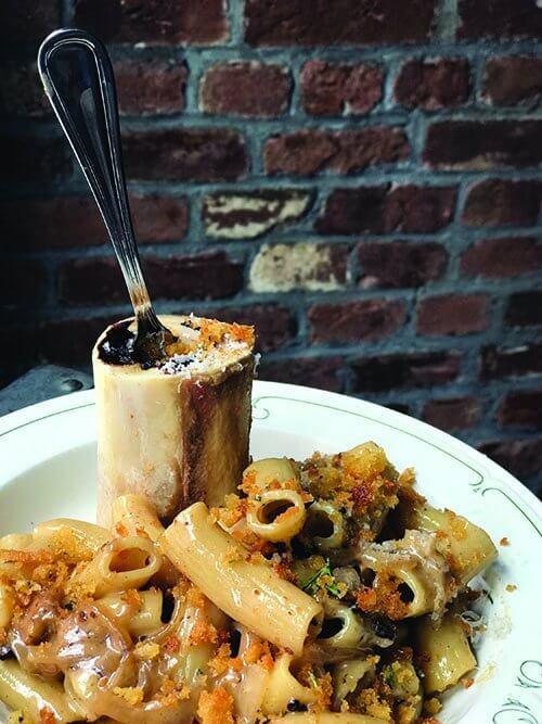 The Cookery serves up hearty comfort by combining rigatoni, bone marrow, caramelized onion and Madeira. The roasted marrow bone adds playful indulgence.