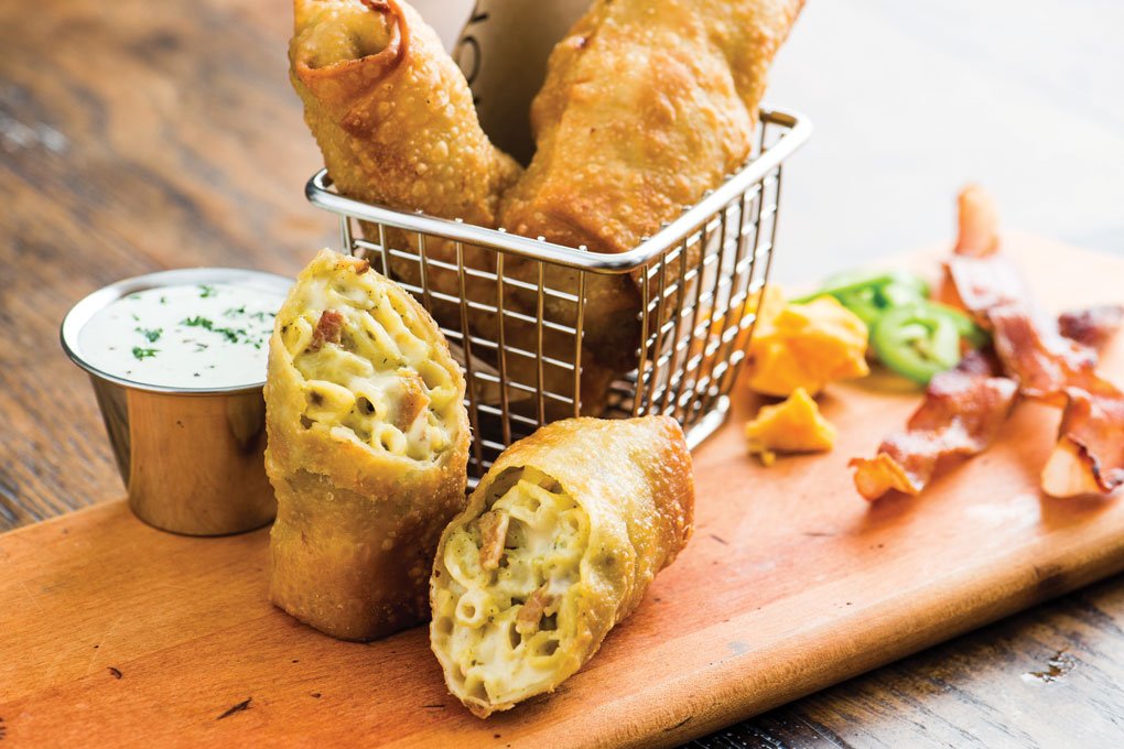 Eatertainment venues often feature playful twists on comfort food, like these bacon and green chile mac-and-cheese spring rolls at Topgolf, based in Dallas