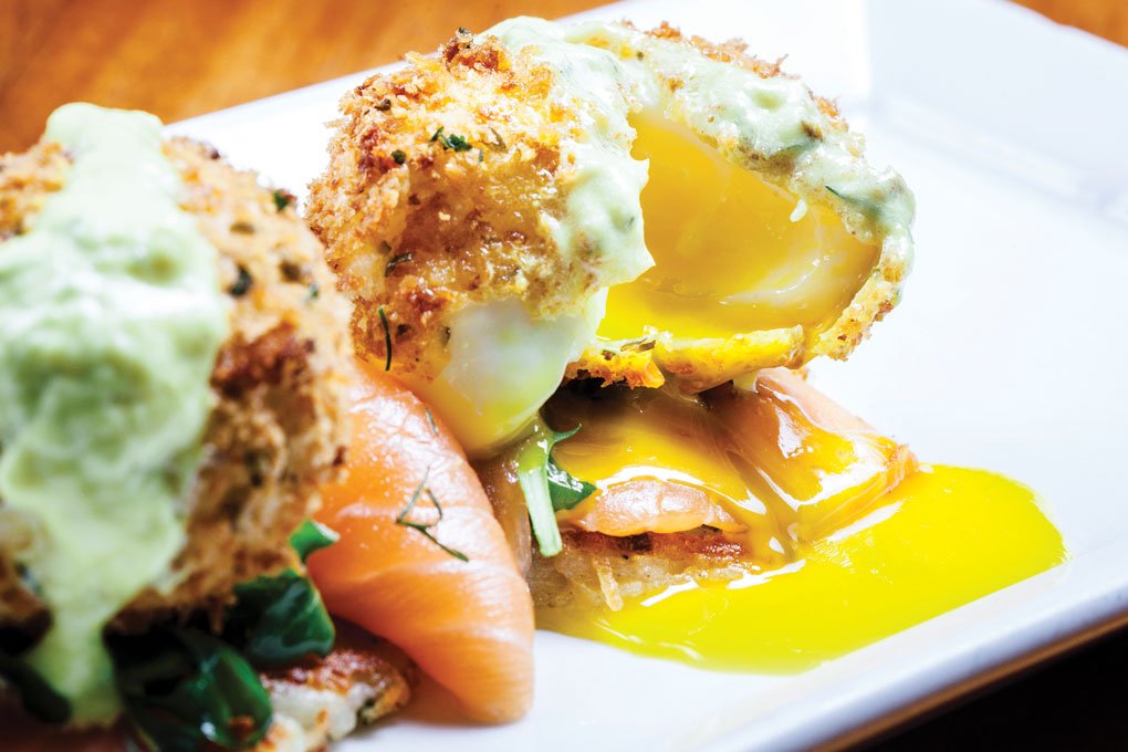 In Las Vegas, RM Seafood spins lox and bagel into a modern brunch item with a dried caper and bread crumb-crusted egg, potato latke and dill crème fraîche.