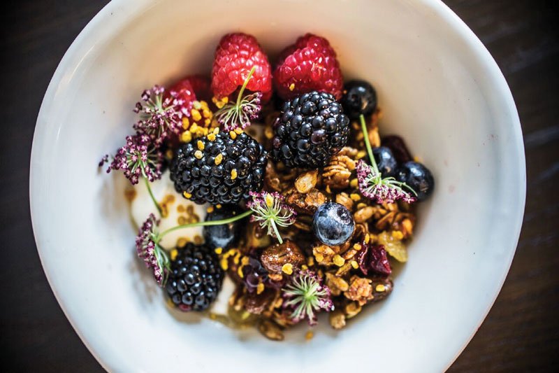 The artistic Goat Yogurt and Muesli bowl at Henley in Nashville, Tenn., showcases berries, mint and bee pollen atop a yogurt base.