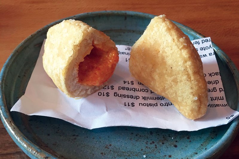 At Better Half in Atlanta, the Pimento Cheese Empanada is served as an introductory bite, melding Southern with Latin in a unique, craveable dish