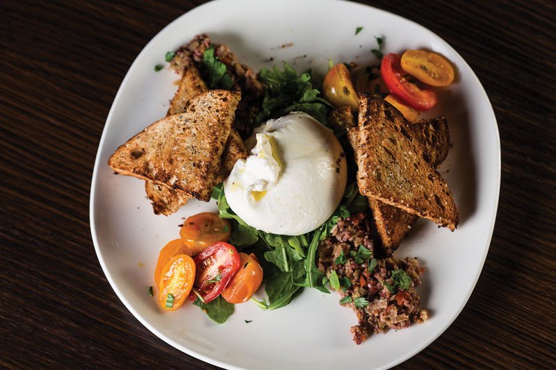 Trending flavors are showcased at Alamo Drafthouse Cinema. Burrata and heirloom tomatoes come with tapenade and toast