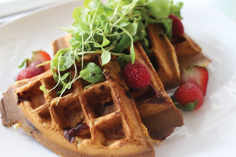 A twist on a Southern classic: The chicken breast is inside the waffle in the Waffle Fried Chicken at the Café du Parc in Washington, D.C.